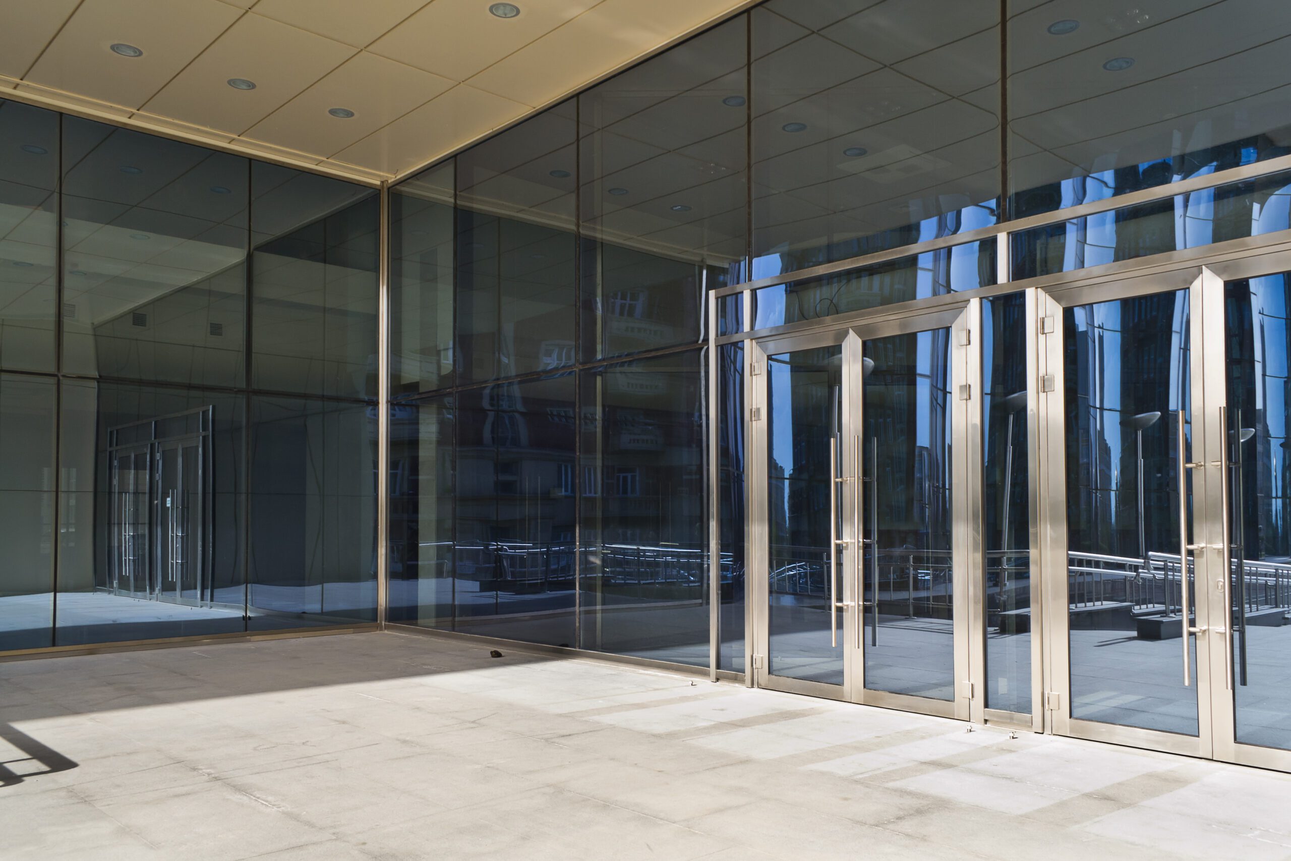 Glass,Closed,Doors,Of,The,Entrance,In,Modern,Building Downtown building lights